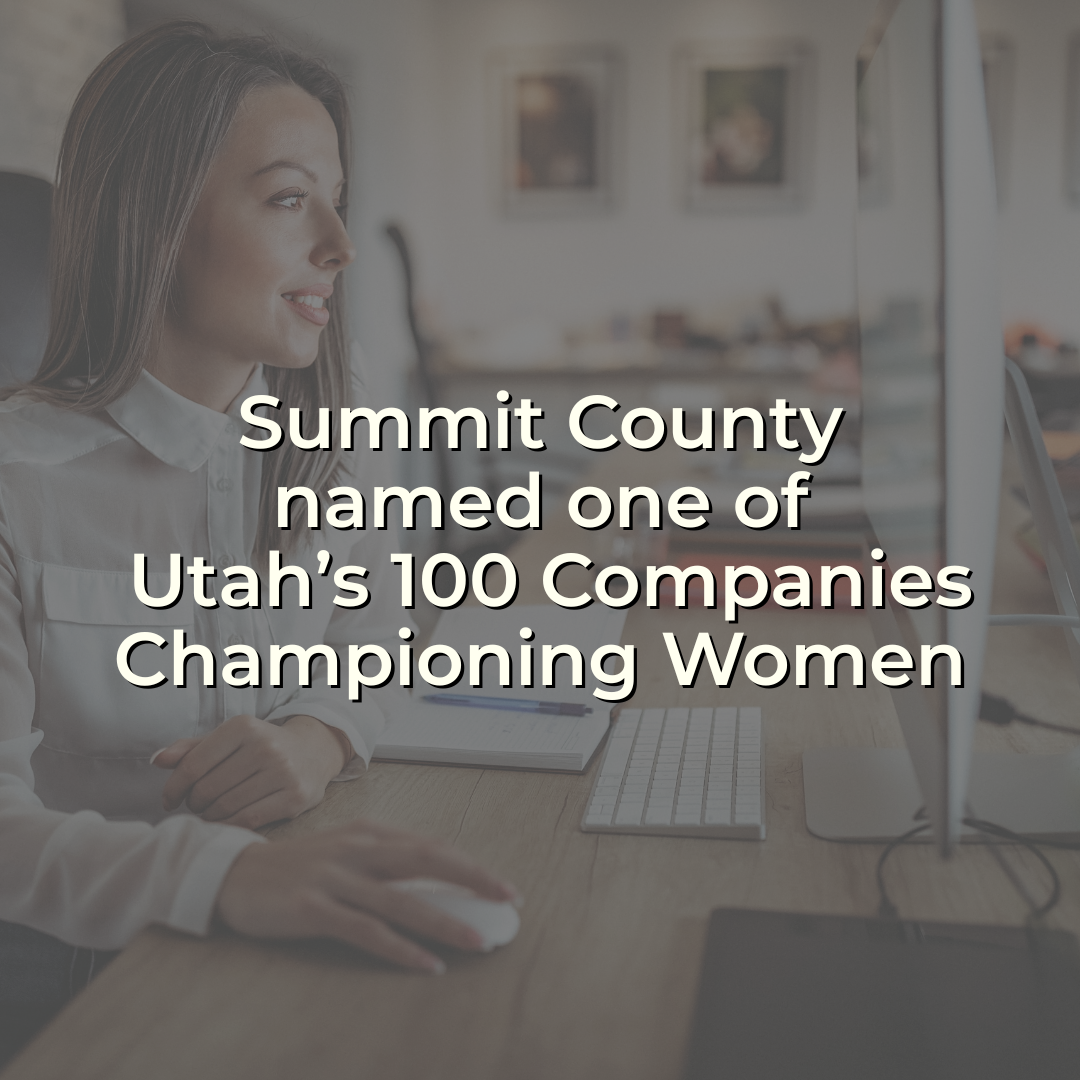 Woman working at a computer desk with text overlay